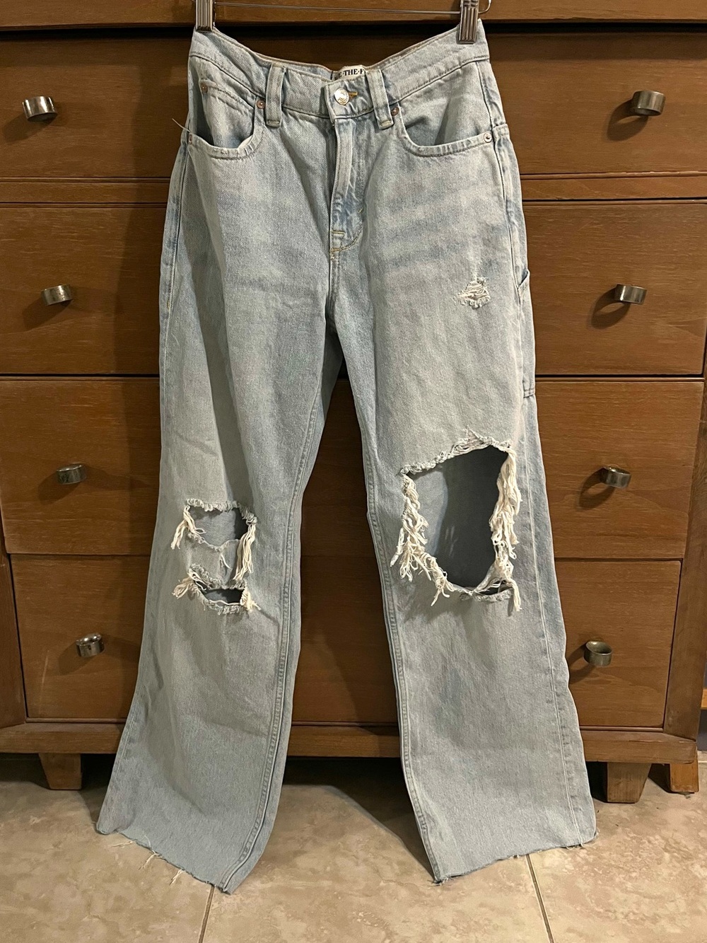 Free people light wash rip flare jean